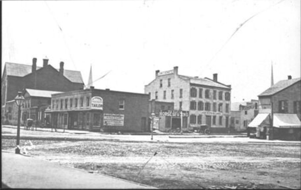 Van Baalen family history -- loan office storefront at Michigan Avenue and Lafayette in Detroit with "Established 1860" signage